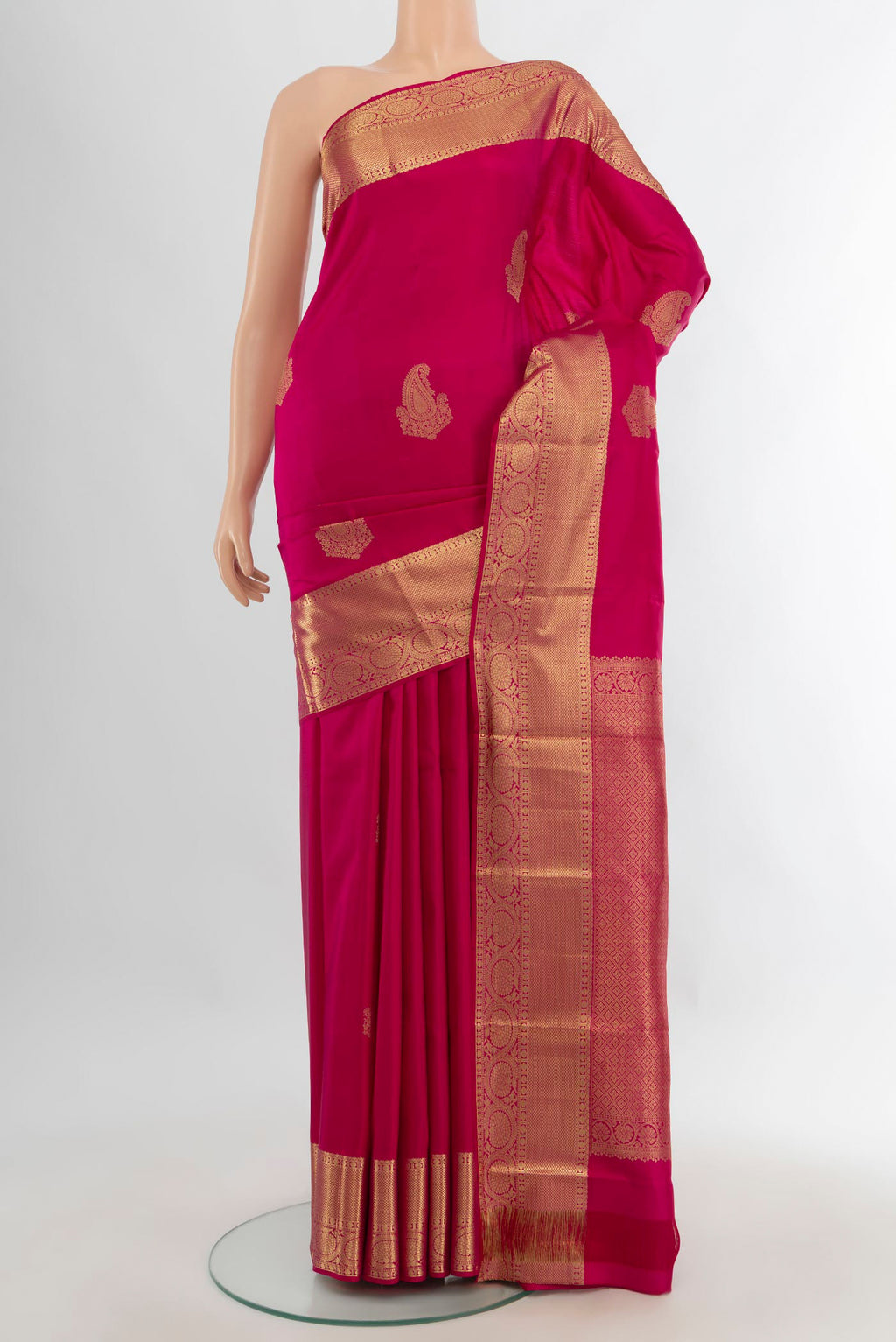 Pure Silk Dark Pink Kanchipuram Saree with Zari Butta on the body and Zari Border.  displayed on a mannequin