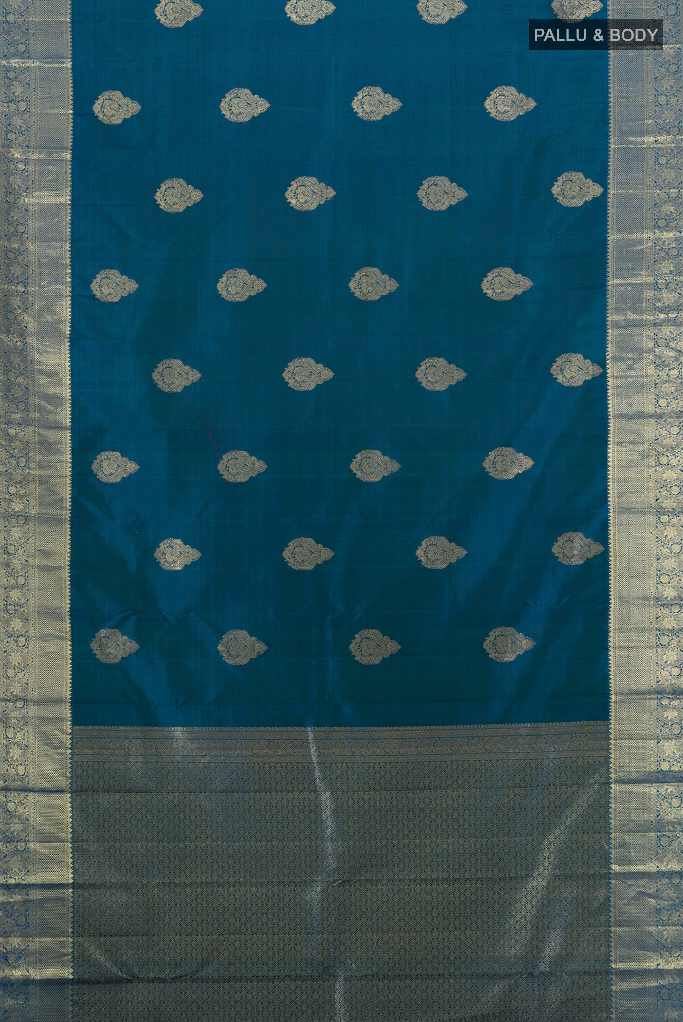 Flat view of Dark Blue Kanchipuram Silk Saree with Zari Butta on the body and Silk Border. 