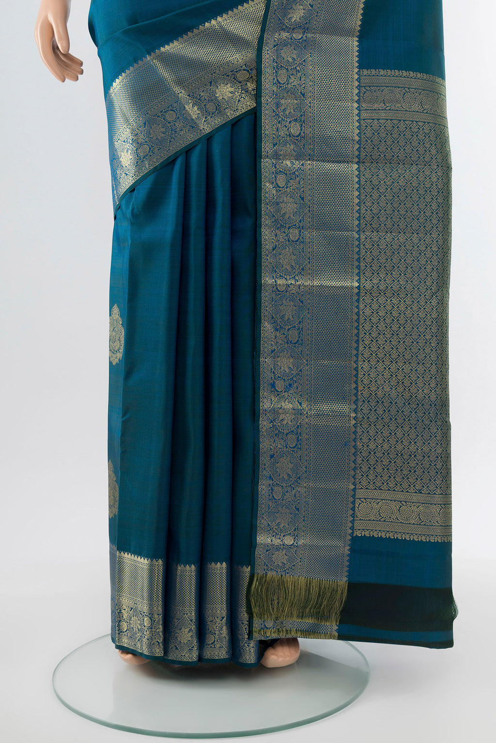 Pleats and pallu of Dark Blue Kanchipuram Silk Saree with Zari Butta on the body and Silk Border. 