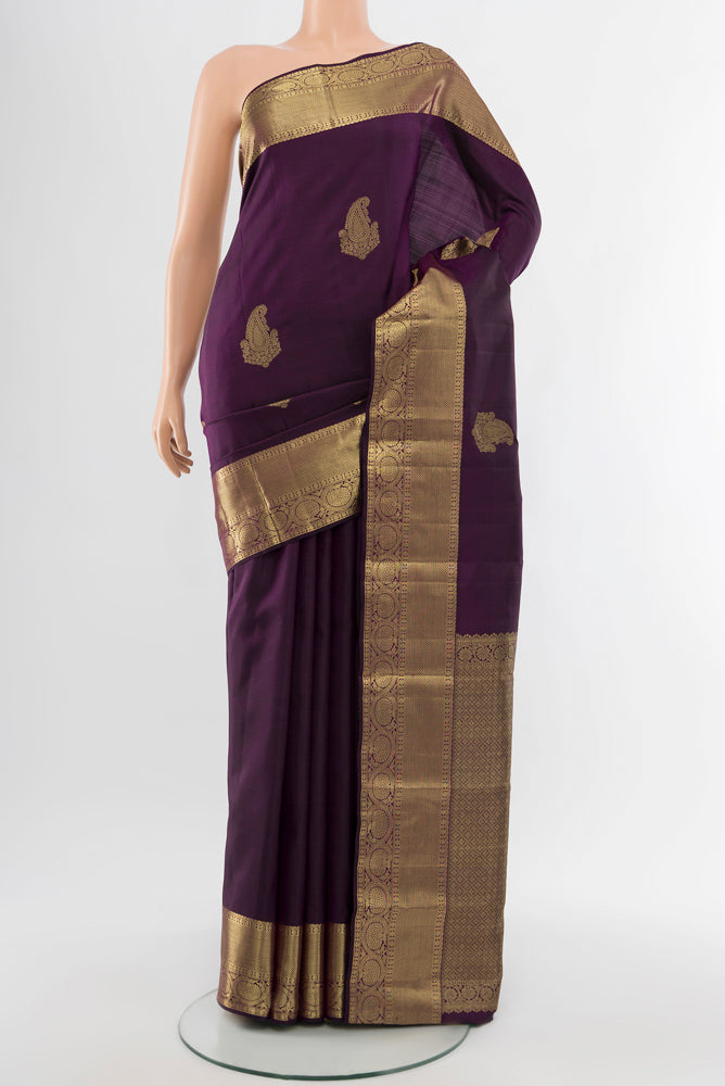 Violet Kanchipuram Silk Saree with Zari Butta on the body and Silk Border.  displayed on a mannequin