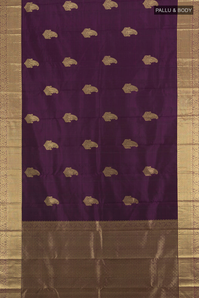 Flat view of Violet Kanchipuram Silk Saree with Zari Butta on the body and Silk Border. 