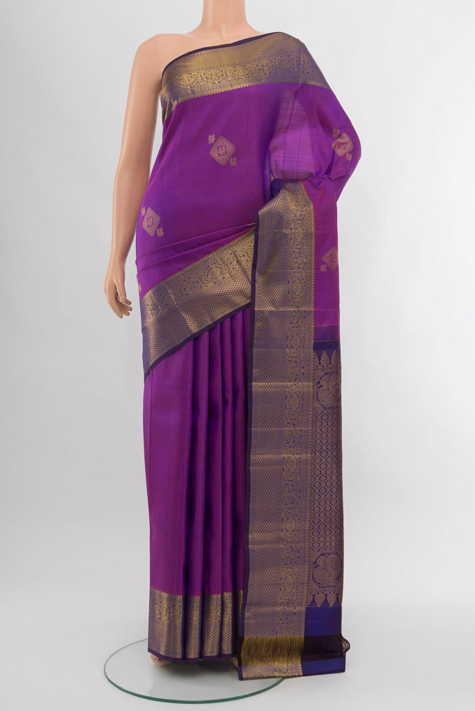 Purple Kanchipuram Silk Saree with Zari Brocade on the body and Silk Border.  displayed on a mannequin