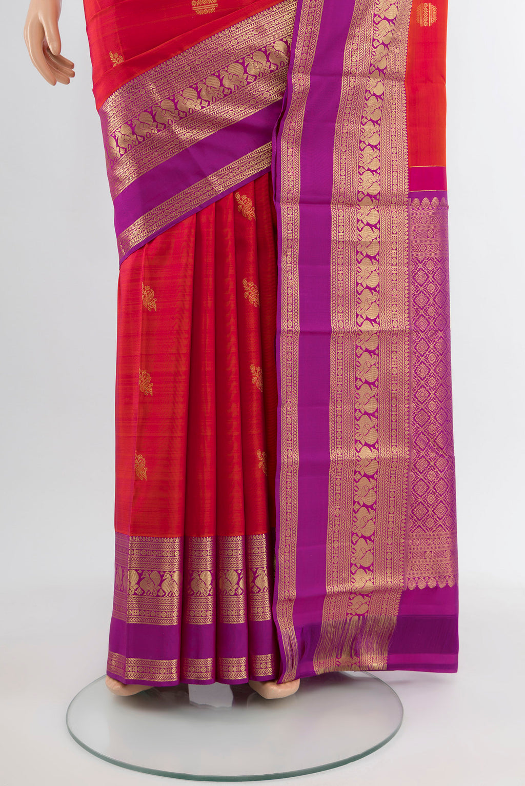 Pleats and pallu of Peach Kanjivaram Silk Saree with Zari Butta on the body and Silk Border. 