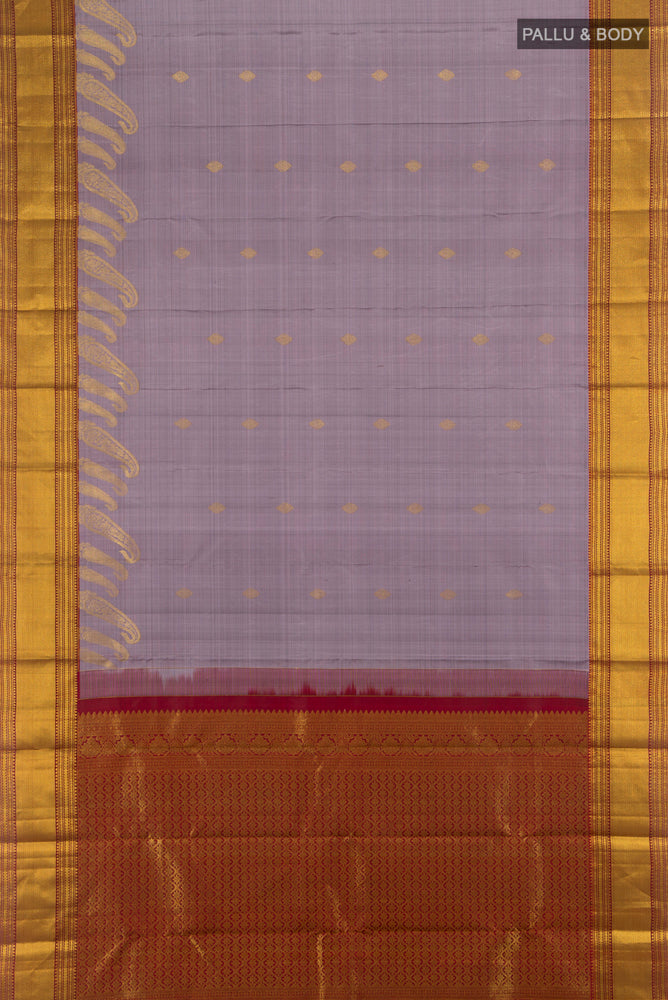Flat view of Lavender Kanjivaram Silk Saree with Zari Butta on the body and Silk Border. 