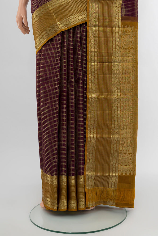 Pleats and pallu of Coffee Brown Kanjivaram Silk Saree with Zari Butta on the body and Silk Border. 
