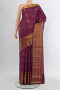 Purple Kanchipuram Silk Saree with Zari Butta on the body and Zari Border.  displayed on a mannequin