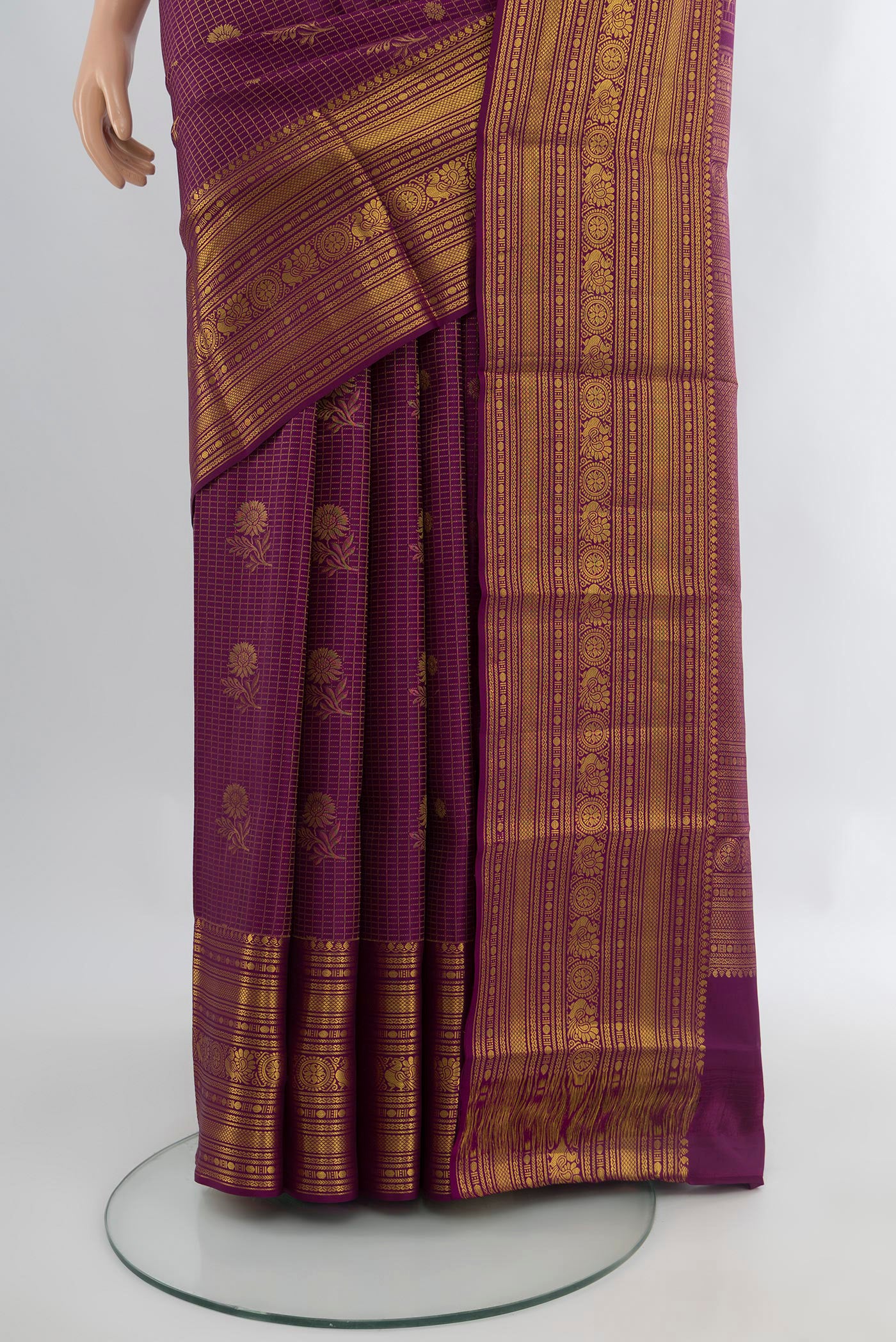 Pleats and pallu of Purple Kanchipuram Silk Saree with Zari Butta on the body and Zari Border. 