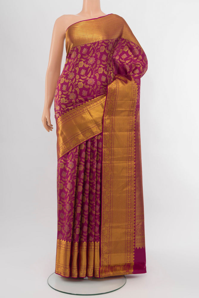 Dark Pink Kanjivaram Silk Saree with Zari Brocade on the body and Silk Border.  displayed on a mannequin