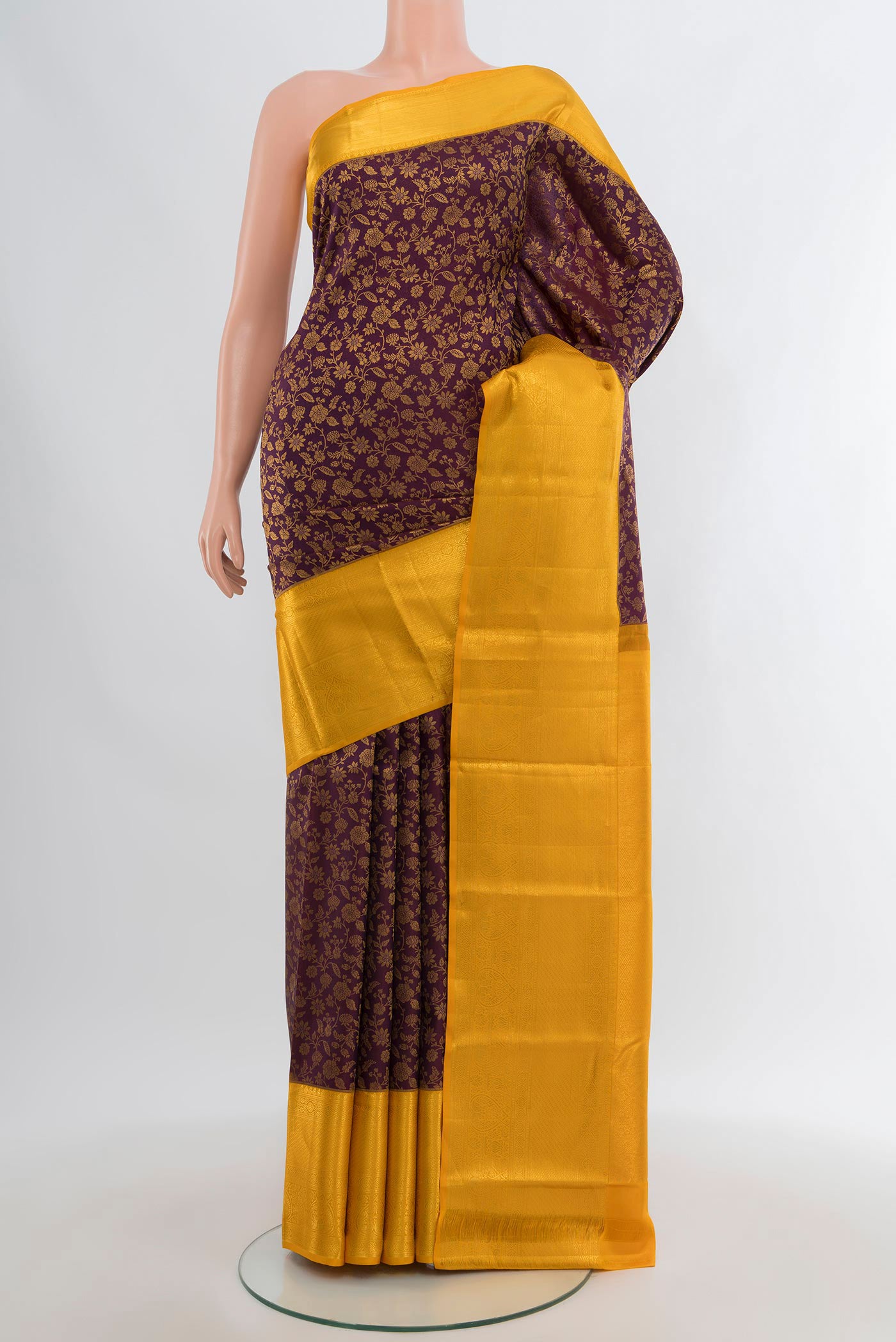 Purple Kanjivaram Silk Saree with Zari Brocade on the body and Zari Border.  displayed on a mannequin