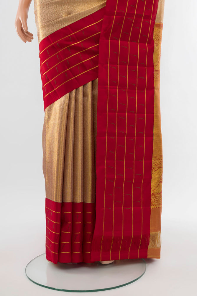 Pleats and pallu of Golden Kanjivaram Silk Saree with Zari Butta on the body and Silk Border. 