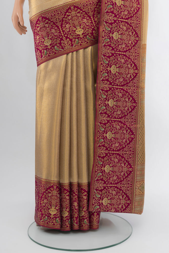 Pleats and pallu of Golden Kanjivaram Silk Saree with Zari Butta on the body and Silk Border. 