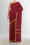 Pure Silk Maroon Kanjivaram Saree with Plain Body and Zari Border.  displayed on a mannequin