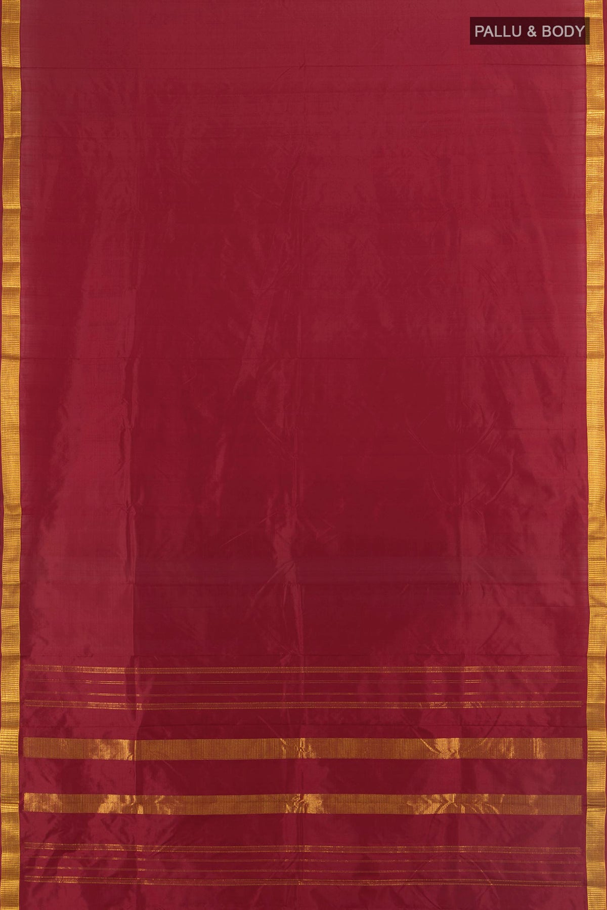 Flat view of Pure Silk Maroon Kanjivaram Saree with Plain Body and Zari Border. 