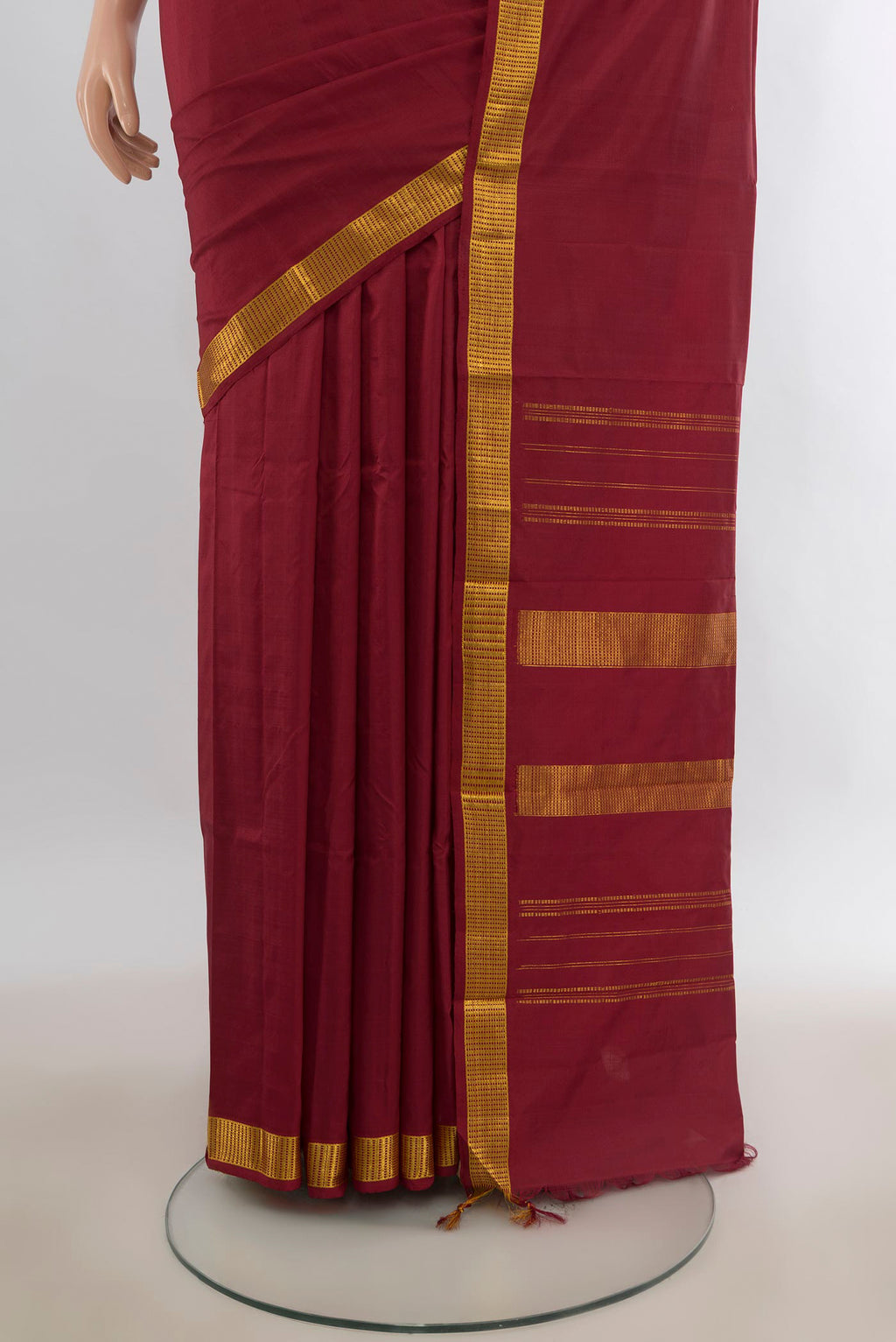 Pleats and pallu of Pure Silk Maroon Kanjivaram Saree with Plain Body and Zari Border. 
