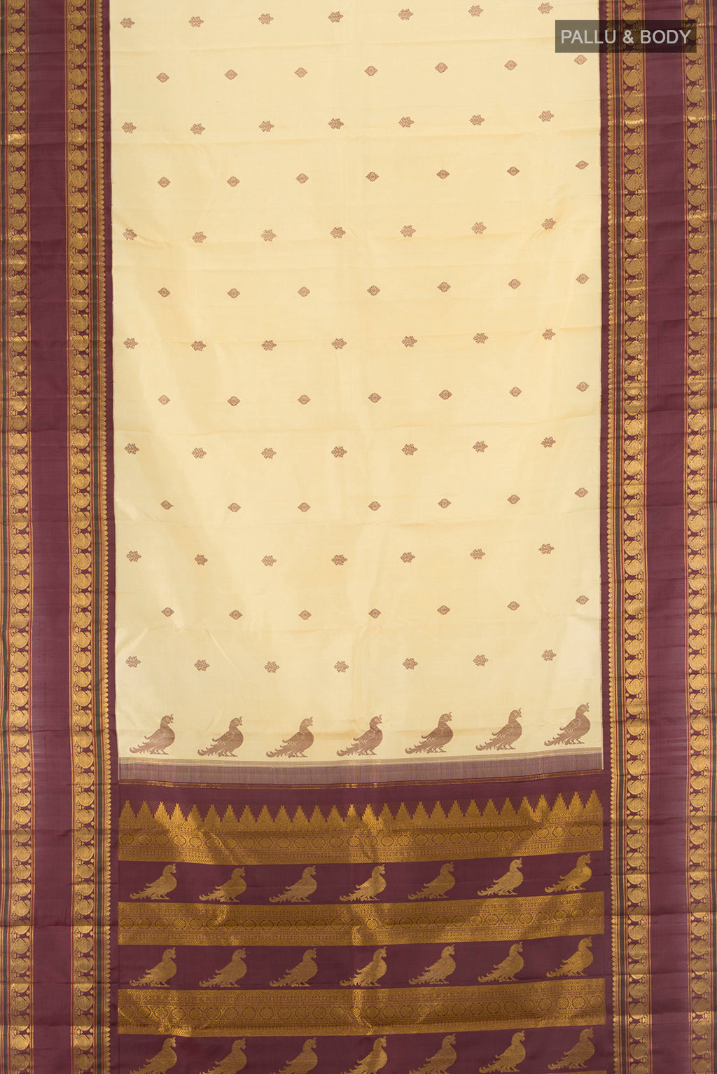 Flat view of Sandal Kanchipuram Silk Saree with Thread Butta on the body and Zari Border. 