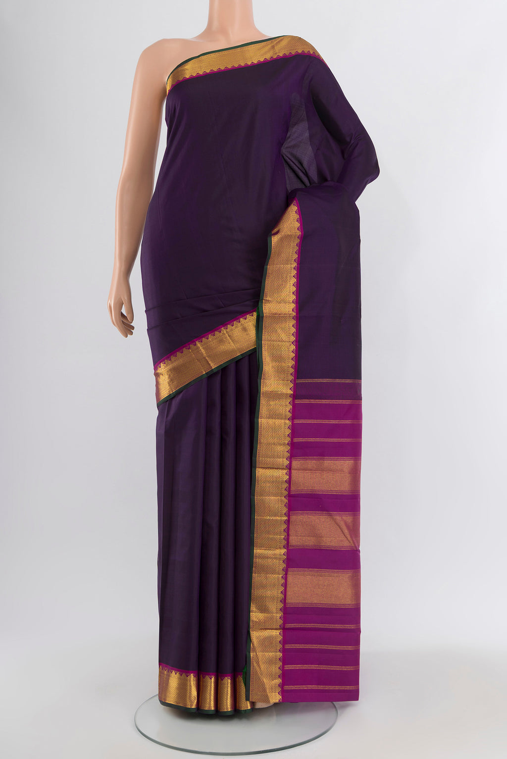Navy Blue Kanchipuram Silk Saree with Plain Body and Zari Border.  displayed on a mannequin