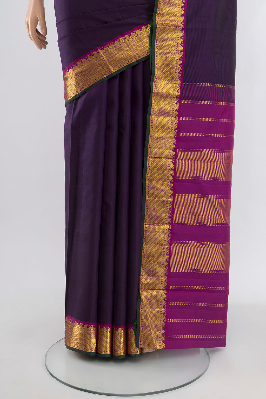 Pleats and pallu of Navy Blue Kanchipuram Silk Saree with Plain Body and Zari Border. 