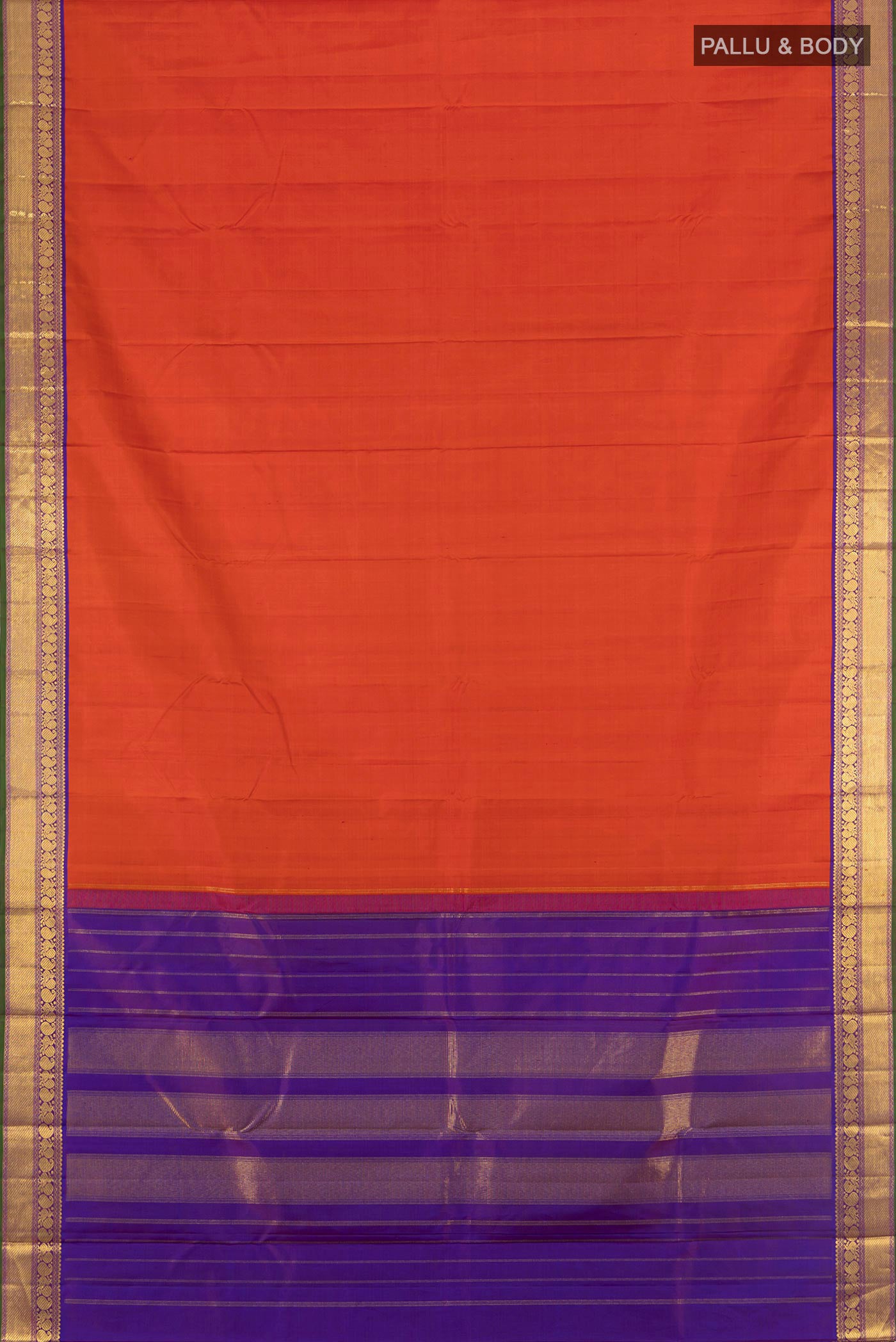 Flat view of Rust Kanchipuram Silk Saree with Zari Butta on the body and Zari Border. 