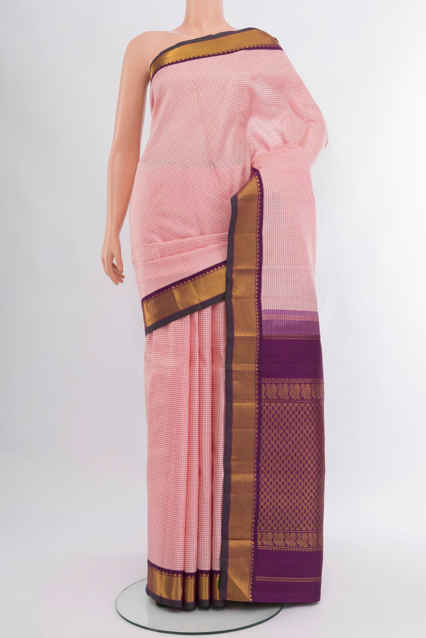 Rose pink Kanjivaram Silk Saree with Checked design on the body and Zari Border.  displayed on a mannequin