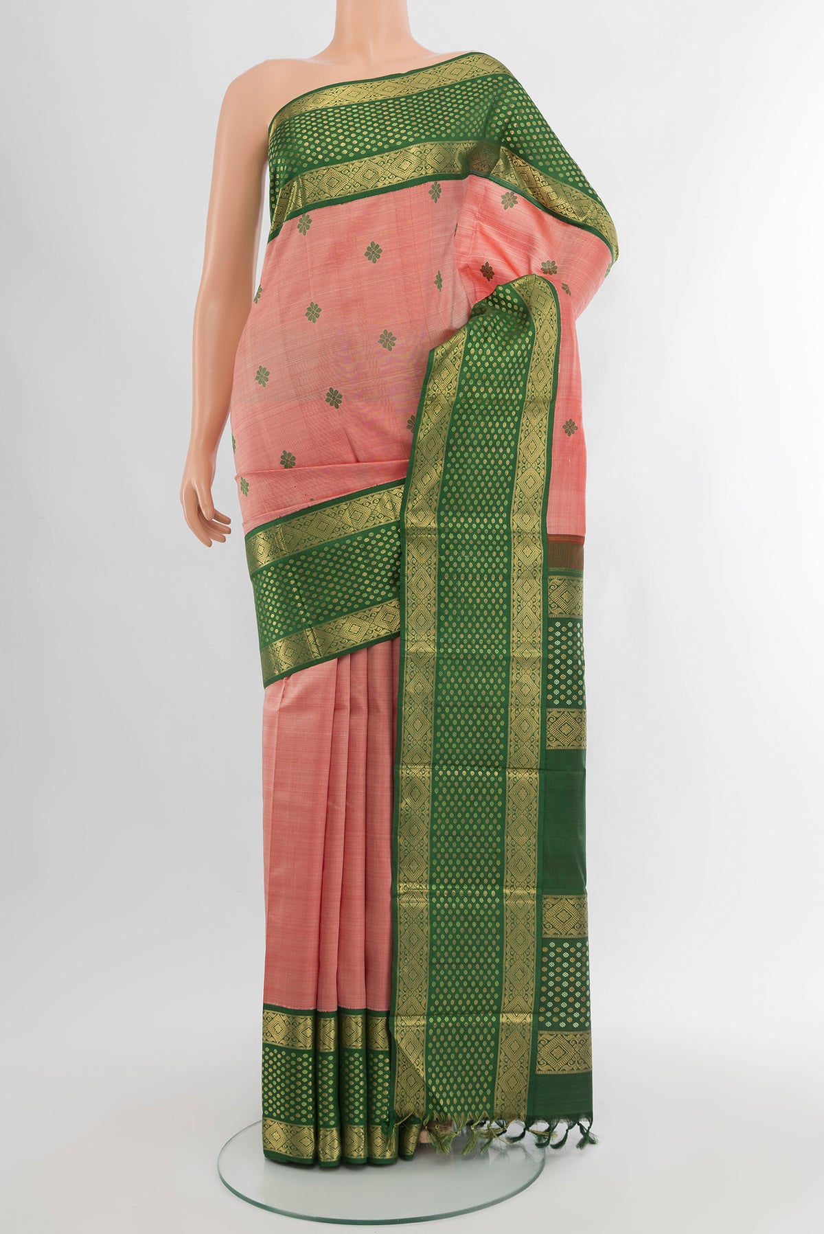 Pink Kanchipuram Silk Saree with Thread Butta on the body and Zari Border.  displayed on a mannequin