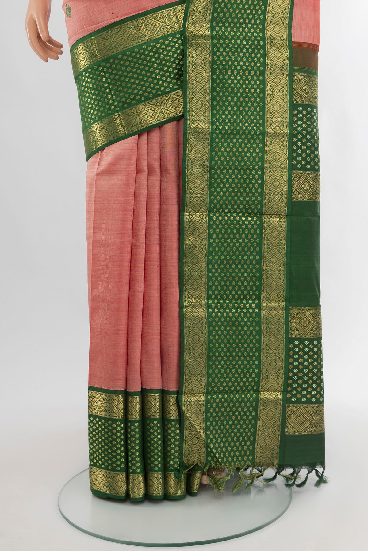 Pleats and pallu of Pink Kanchipuram Silk Saree with Thread Butta on the body and Zari Border. 