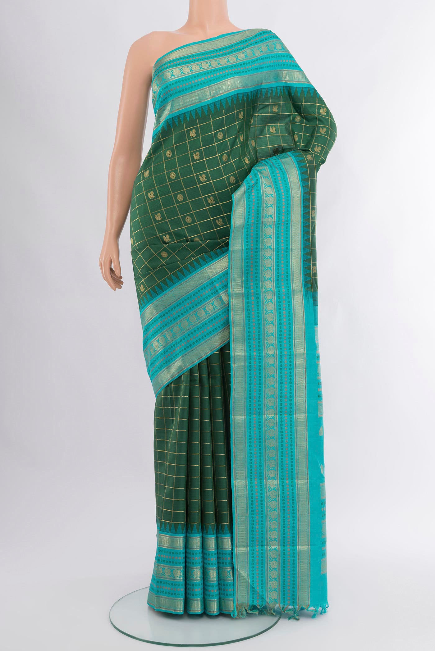 Bottle Green Kanchipuram Silk Saree with Checked design on the body and Zari Border.  displayed on a mannequin