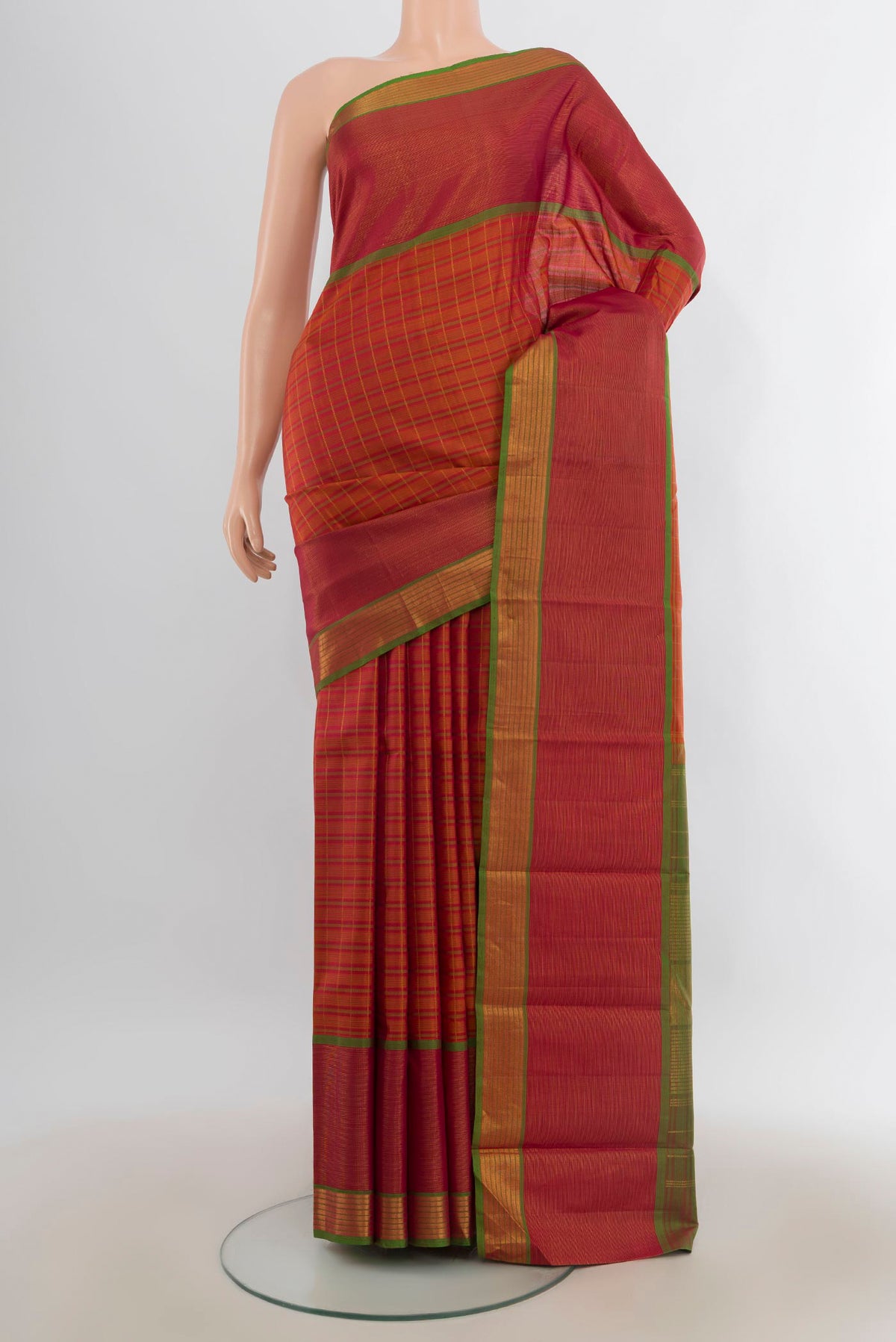 Pure Silk Brick Orange Kanjivaram Saree with Stripes on the body and Zari Border.  displayed on a mannequin