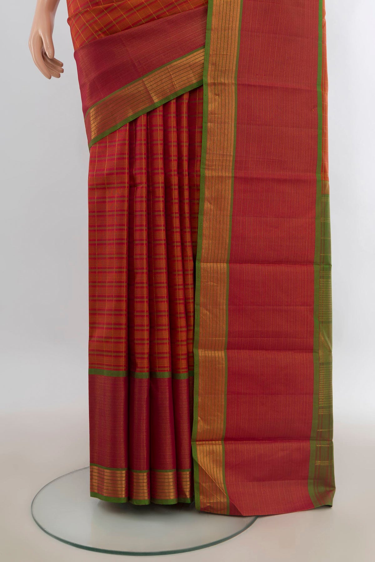 Pleats and pallu of Pure Silk Brick Orange Kanjivaram Saree with Stripes on the body and Zari Border. 