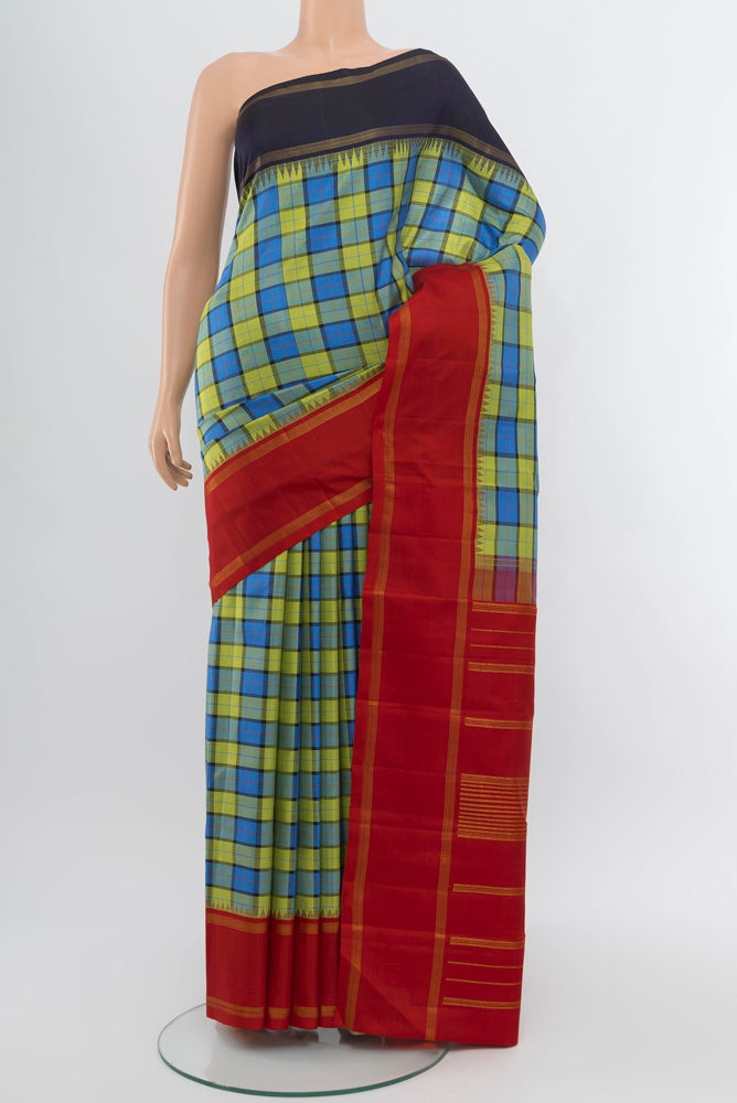 Multi Color Kanjivaram Silk Saree with Zari Butta on the body and Silk Border.  displayed on a mannequin