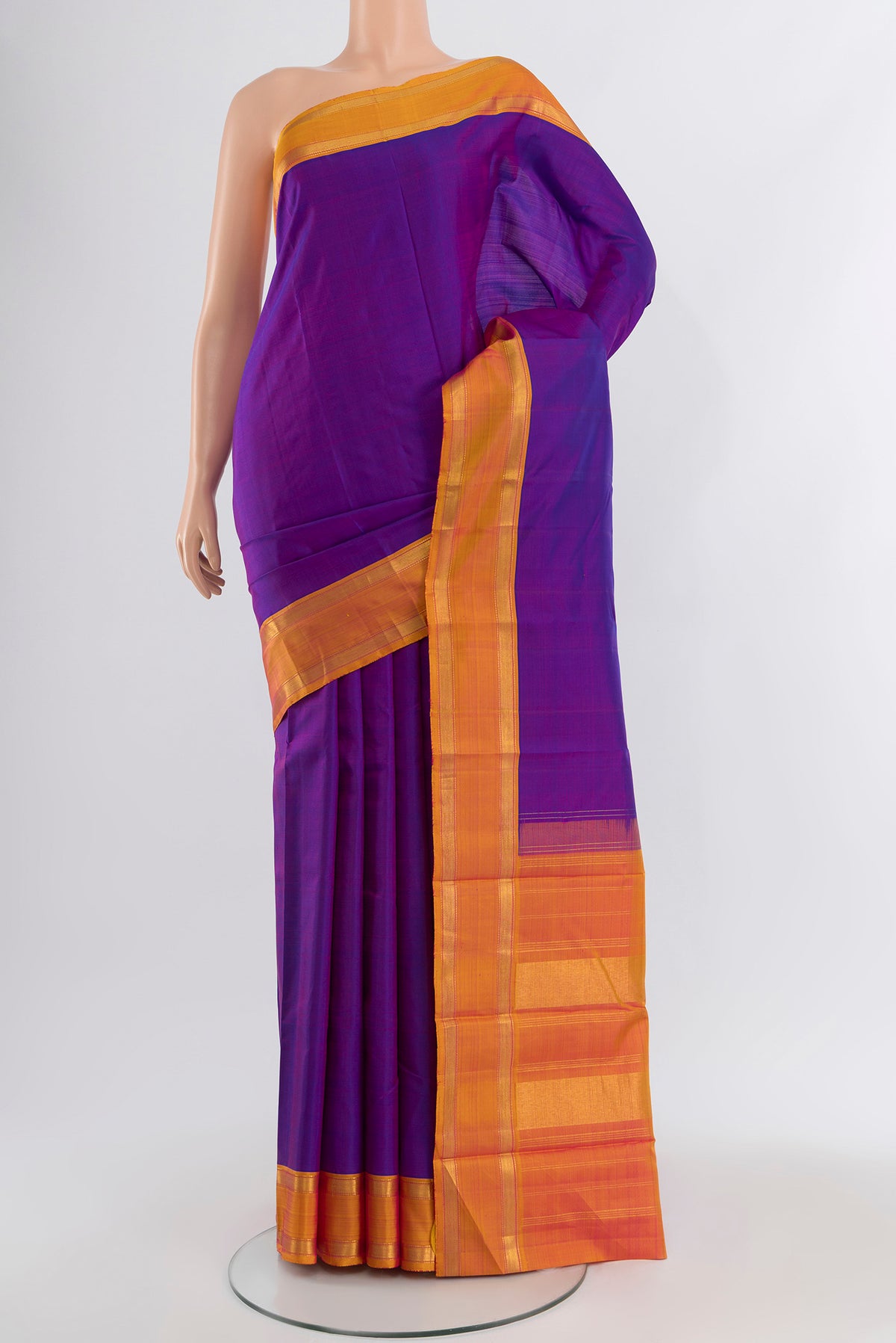 Purple Kanjivaram Silk Saree with Plain Body and Plain Border.  displayed on a mannequin