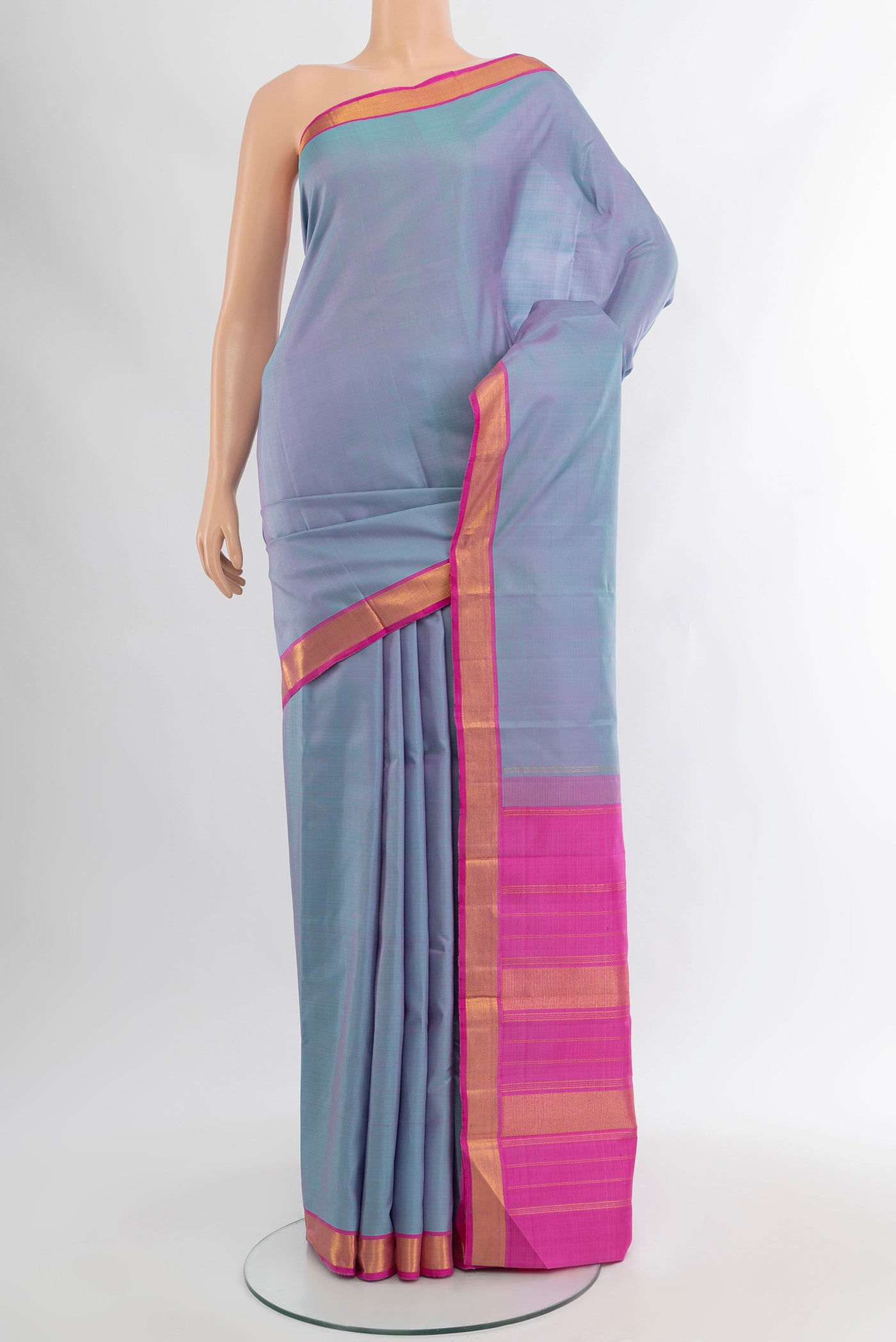 Lavender Kanjivaram Silk Saree with Plain Body and Zari Border.  displayed on a mannequin