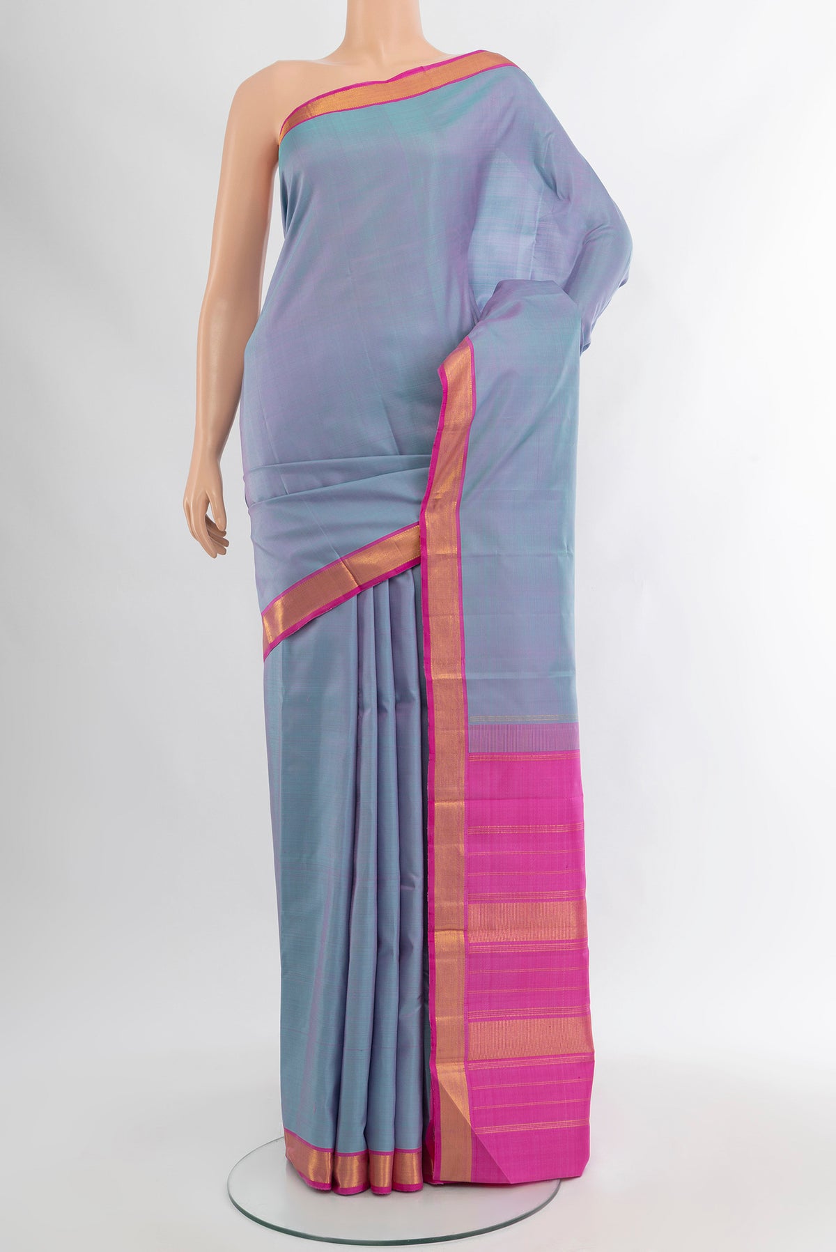 Lavender Kanjivaram Silk Saree with Plain Body and Zari Border.  displayed on a mannequin
