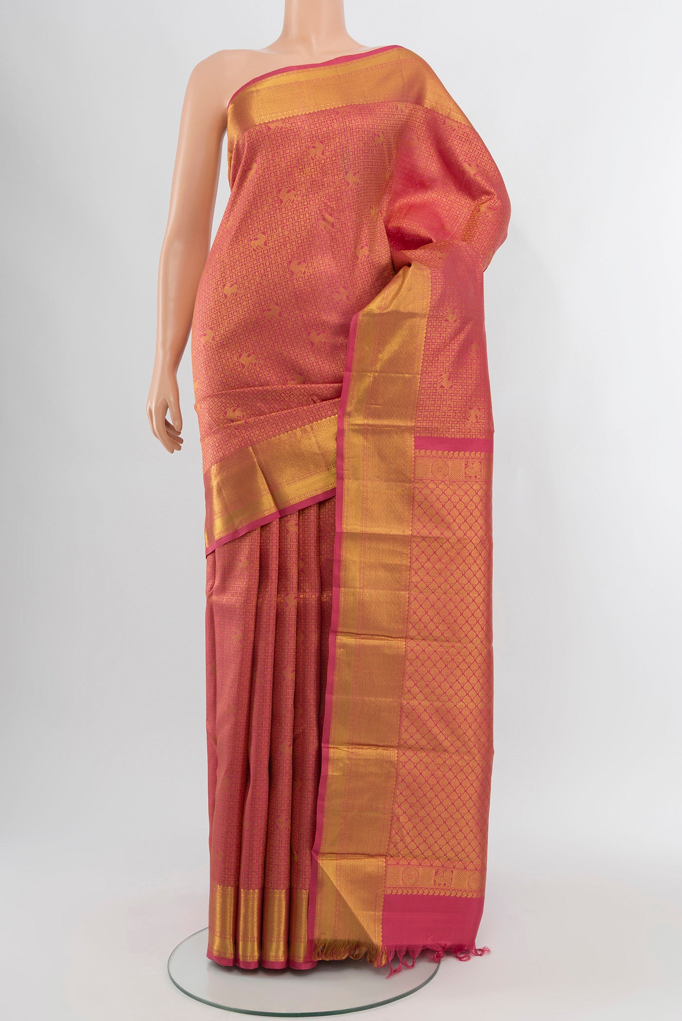 Pink Kanchipuram Silk Saree with Zari Brocade on the body and Zari Border.  displayed on a mannequin