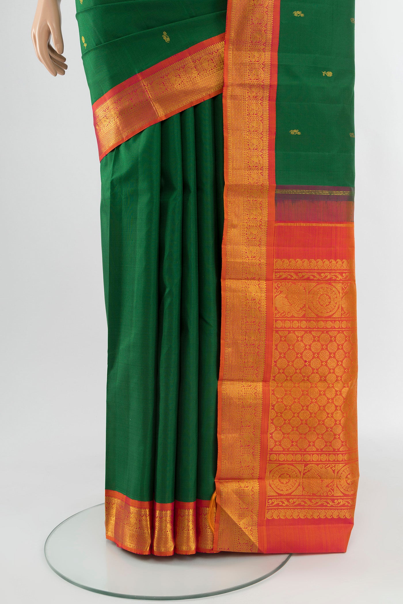 Pleats and pallu of Green Kanjivaram Silk Saree with Zari Butta on the body and Zari Border. 