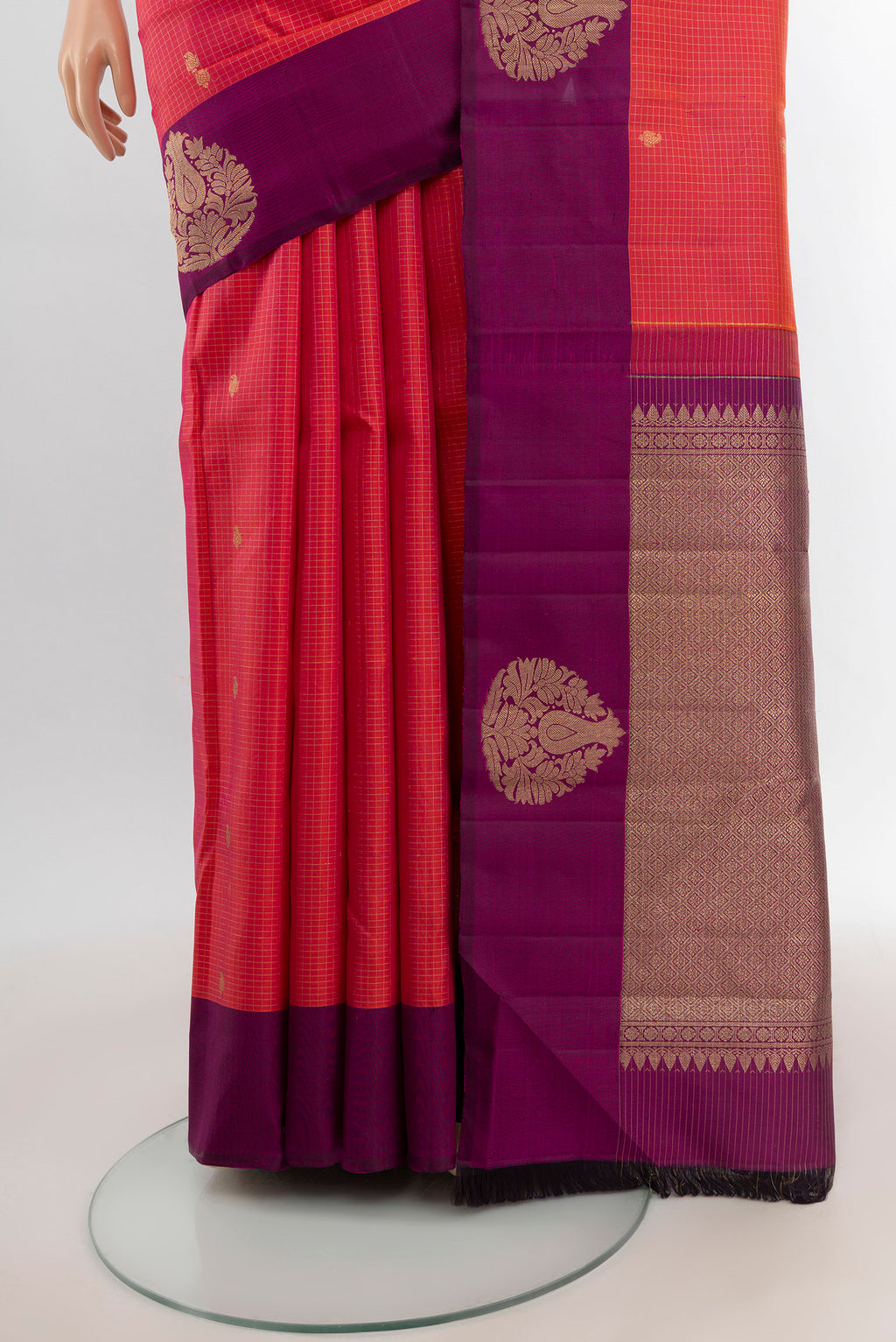 Pleats and pallu of Coral Dual Tone Kanjivaram Silk Saree with Checked design on the body and Plain Border. 