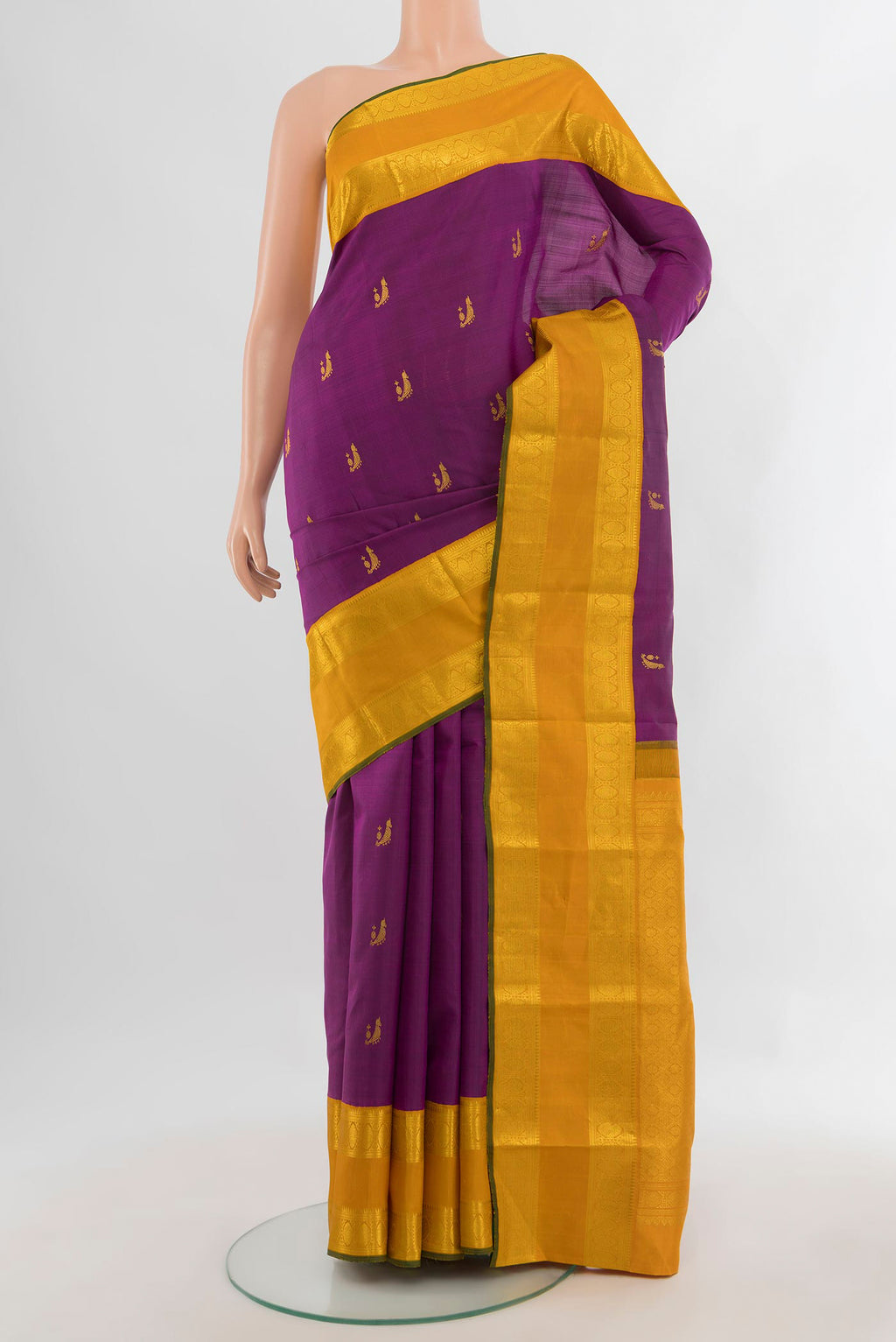 Pure Silk Magenta Kanjivaram Saree with Zari Butta on the body and Zari Border.  displayed on a mannequin