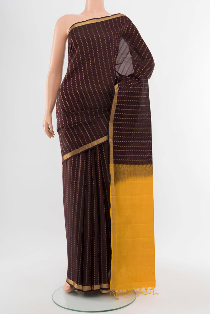 Coffee Brown Soft Silk Saree with Zari Butta on the body and Silk Border.  displayed on a mannequin