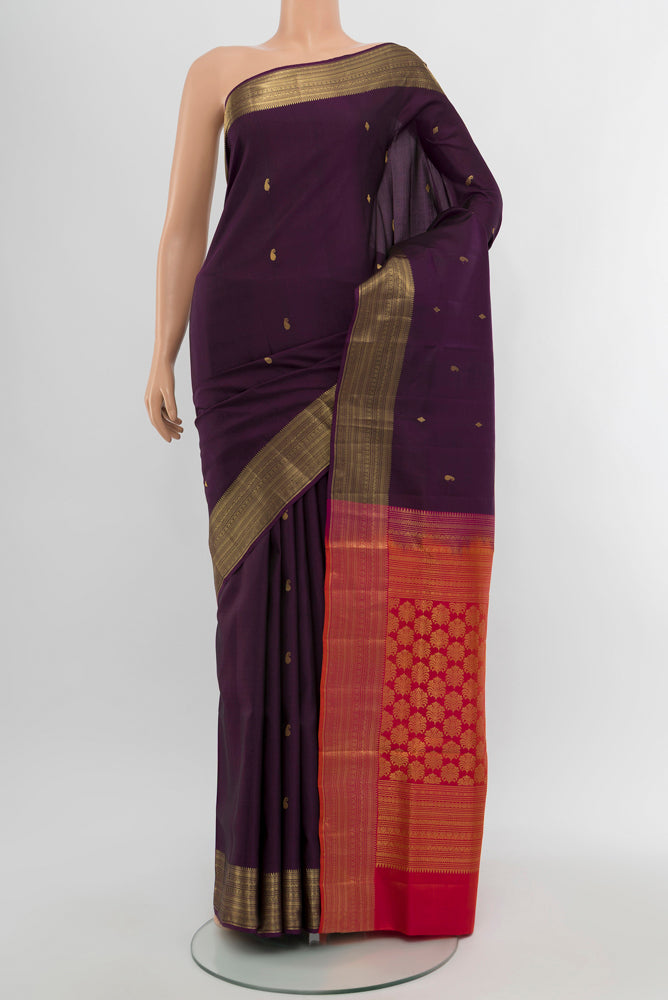 Violet Soft Silk Saree with Zari Butta on the body and Silk Border.  displayed on a mannequin