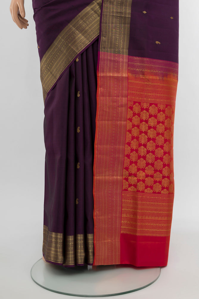 Pleats and pallu of Violet Soft Silk Saree with Zari Butta on the body and Silk Border. 