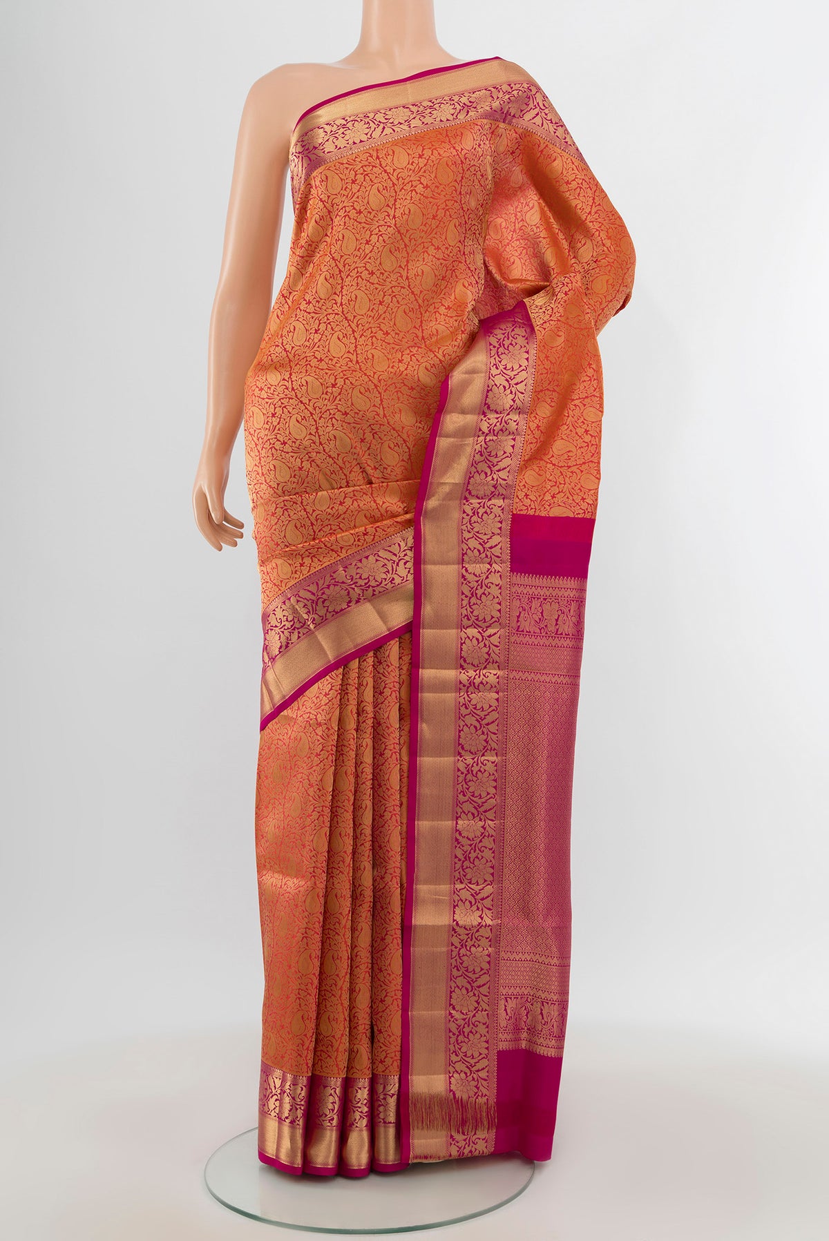 Brick Orange Soft Silk Saree with Zari Brocade on the body and Zari Border.  displayed on a mannequin