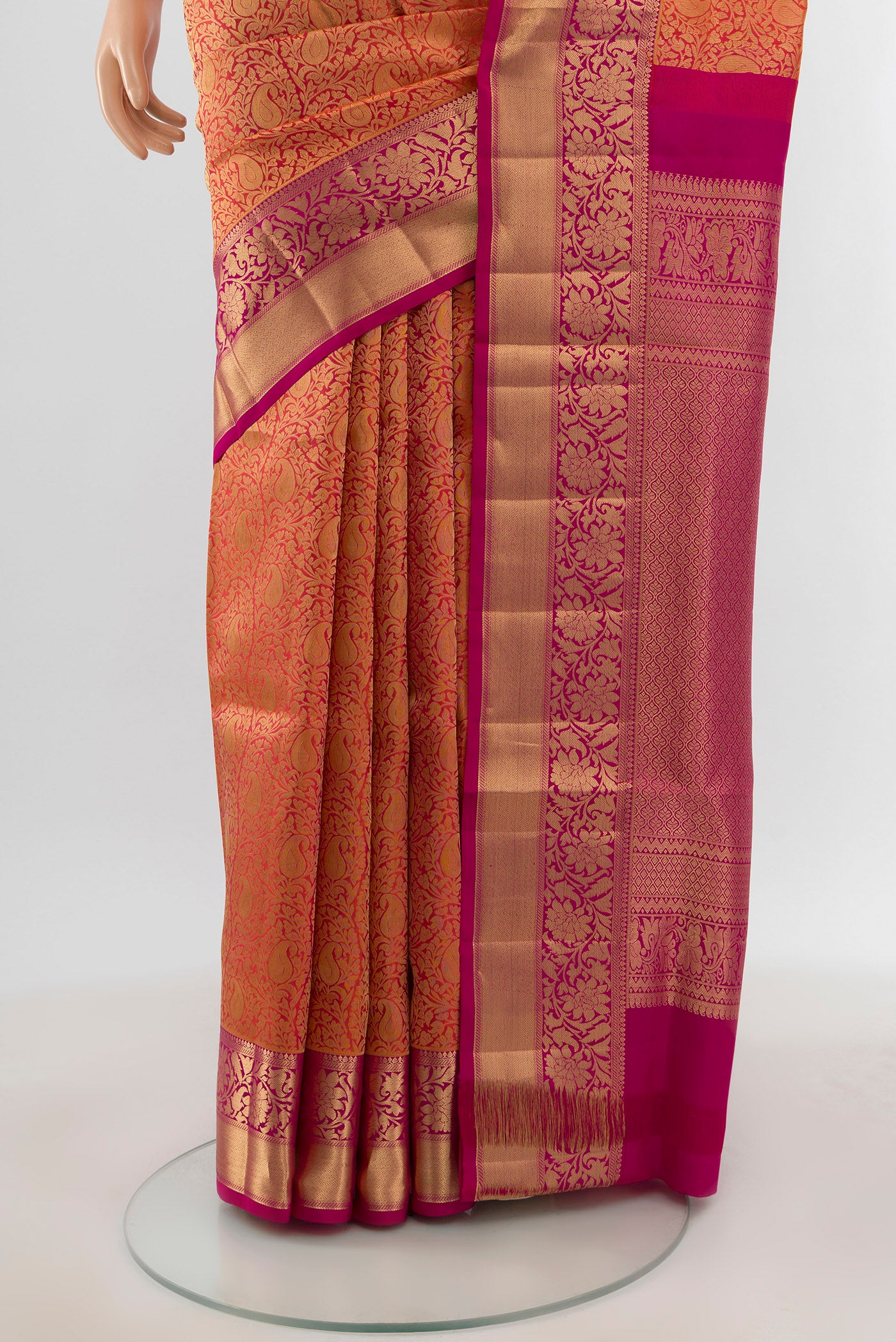 Pleats and pallu of Brick Orange Soft Silk Saree with Zari Brocade on the body and Zari Border. 