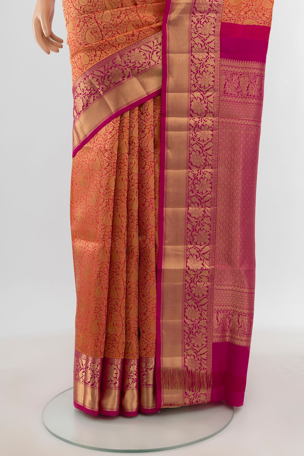 Pleats and pallu of Brick Orange Soft Silk Saree with Zari Brocade on the body and Zari Border. 