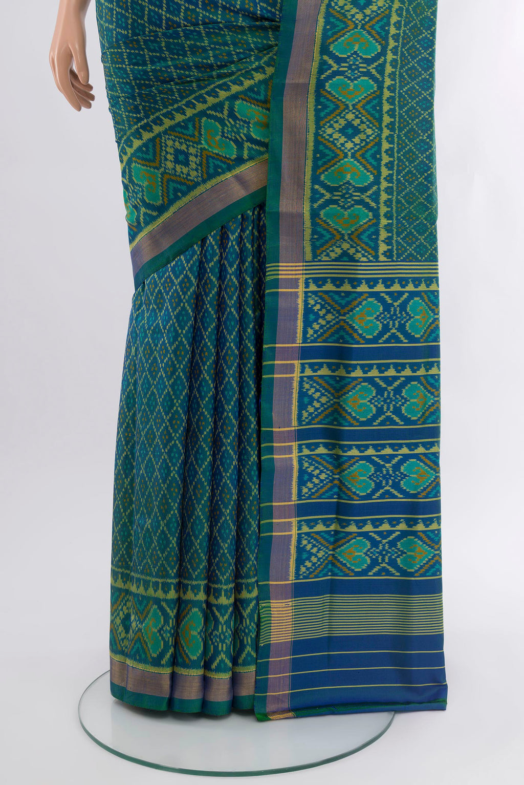 Pleats and pallu of Peacock Blue Dual Tone Rajkot Patola Silk Saree with Pure Ikat on the body and Ikat Border. 