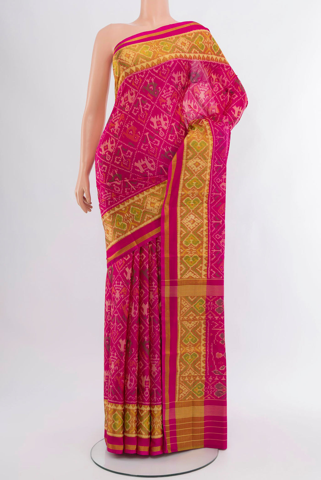 Pink Rajkot Patola Silk Saree with Pure Ikat on the body and Ikat Border.  displayed on a mannequin