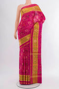 Pink Rajkot Patola Silk Saree with Pure Ikat on the body and Ikat Border.  displayed on a mannequin