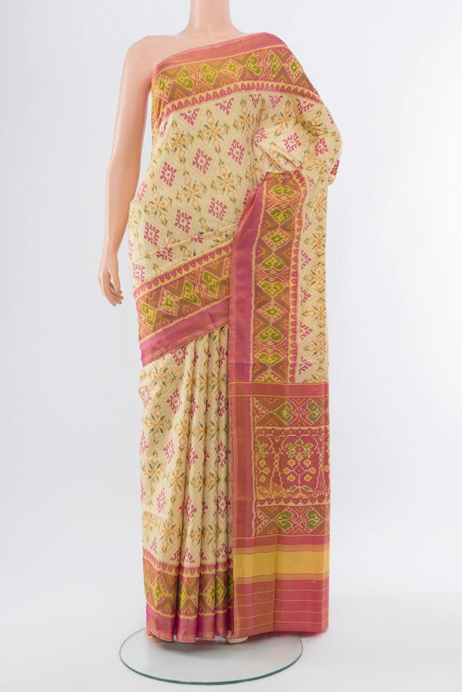 Multi Color Rajkot Patola Silk Saree with Ikat Print on the body and Silk Border.  displayed on a mannequin
