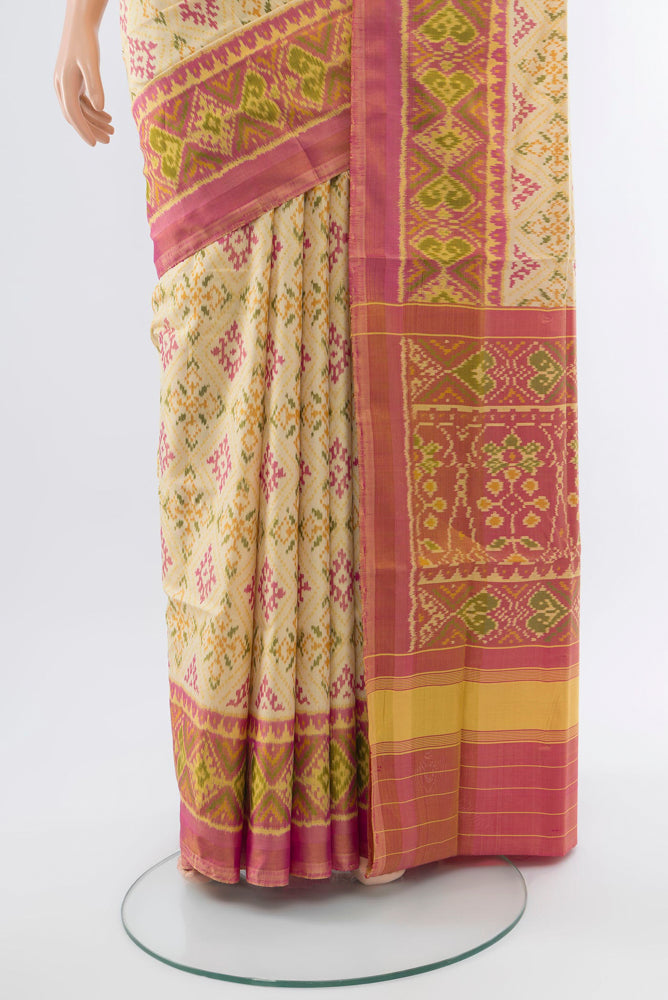 Pleats and pallu of Multi Color Rajkot Patola Silk Saree with Ikat Print on the body and Silk Border. 