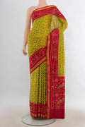 Pure Silk Green Rajkot Patola Saree with Pure Ikat on the body and Ikat Border.  displayed on a mannequin