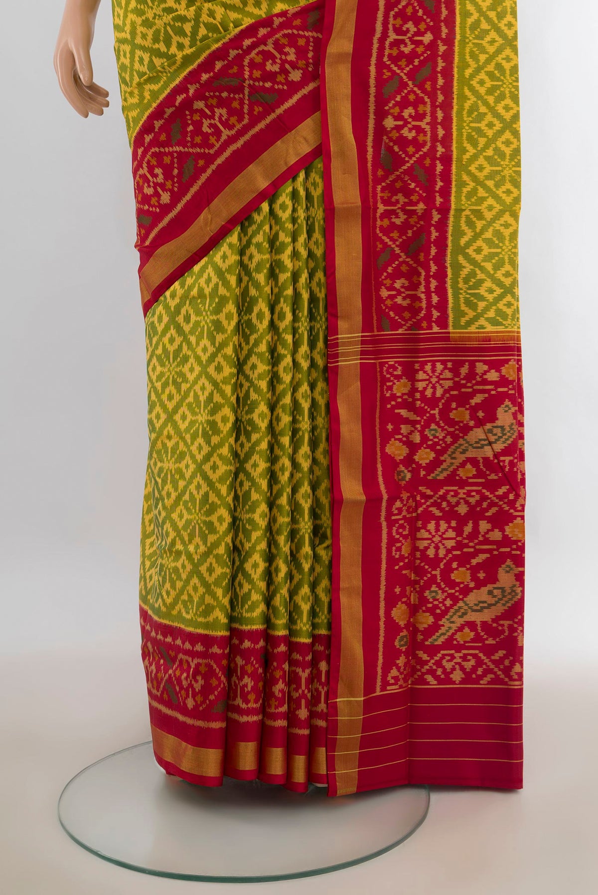 Pleats and pallu of Pure Silk Green Rajkot Patola Saree with Pure Ikat on the body and Ikat Border. 