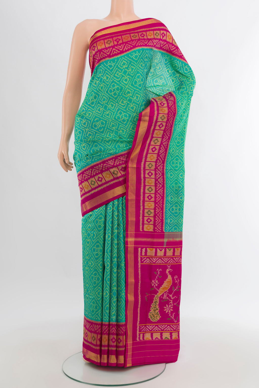 Sea Green Rajkot Patola Silk Saree with Pure Ikat on the body and Ikat Border.  displayed on a mannequin